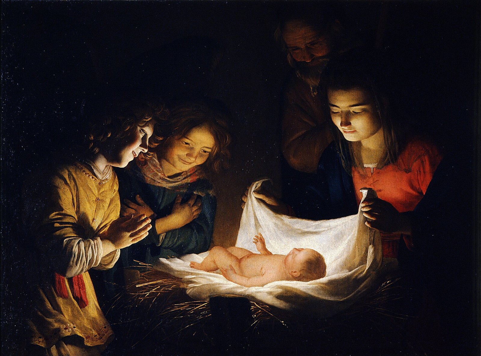 O Menino Jesus deitado na manjedoura, iluminado por uma vela, adorado por Maria, José e anjos