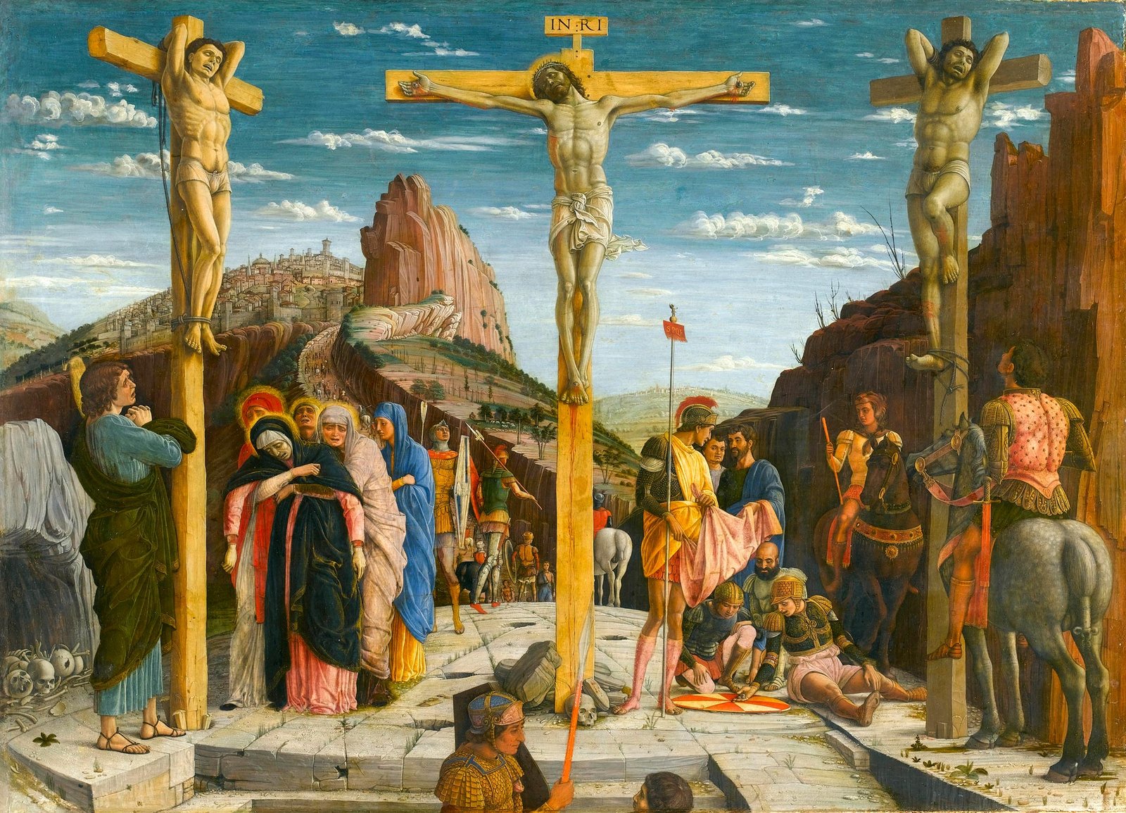 Pintura de Andrea Mantegna da crucificação de Cristo entre dois ladrões, com mulheres aos pés da cruz e soldados ao redor