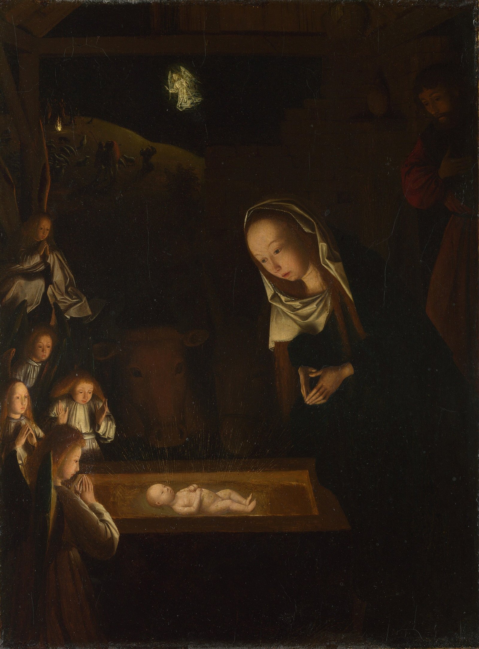 Pintura noturna da natividade: o Menino deitado no chão, rodeado de anjos que o adoram, Maria e José ajoelhados, com o boi e o jumento ao fundo