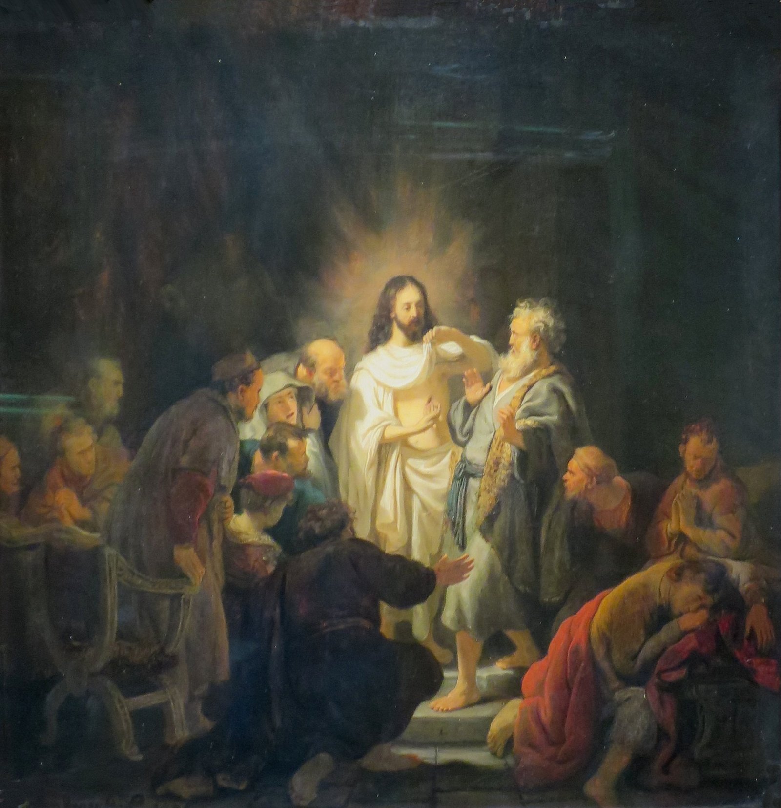 Tomé toca a ferida do lado de Jesus ressuscitado, cercado pelos outros discípulos, na pintura de Rembrandt