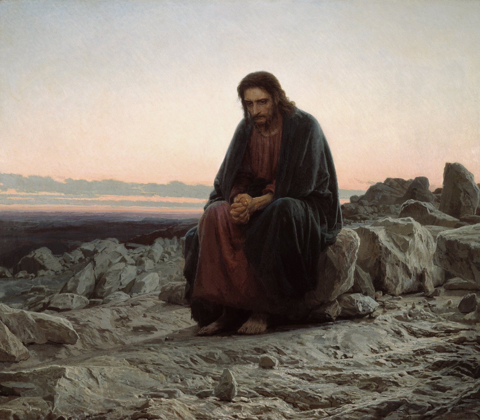Jesus sentado sozinho sobre uma pedra no deserto, de mãos entrelaçadas, ao amanhecer