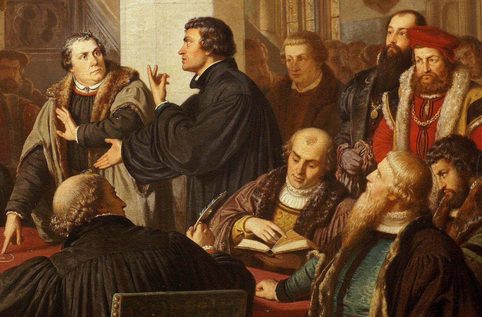 Lutero e Zwingli frente a frente à mesa, com os demais teólogos, no Colóquio de Marburgo, em 1529